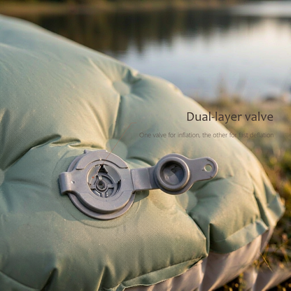 Close-up of the AirRest dual one-way valves on the sleeping pad, showing separate chamber inflation.