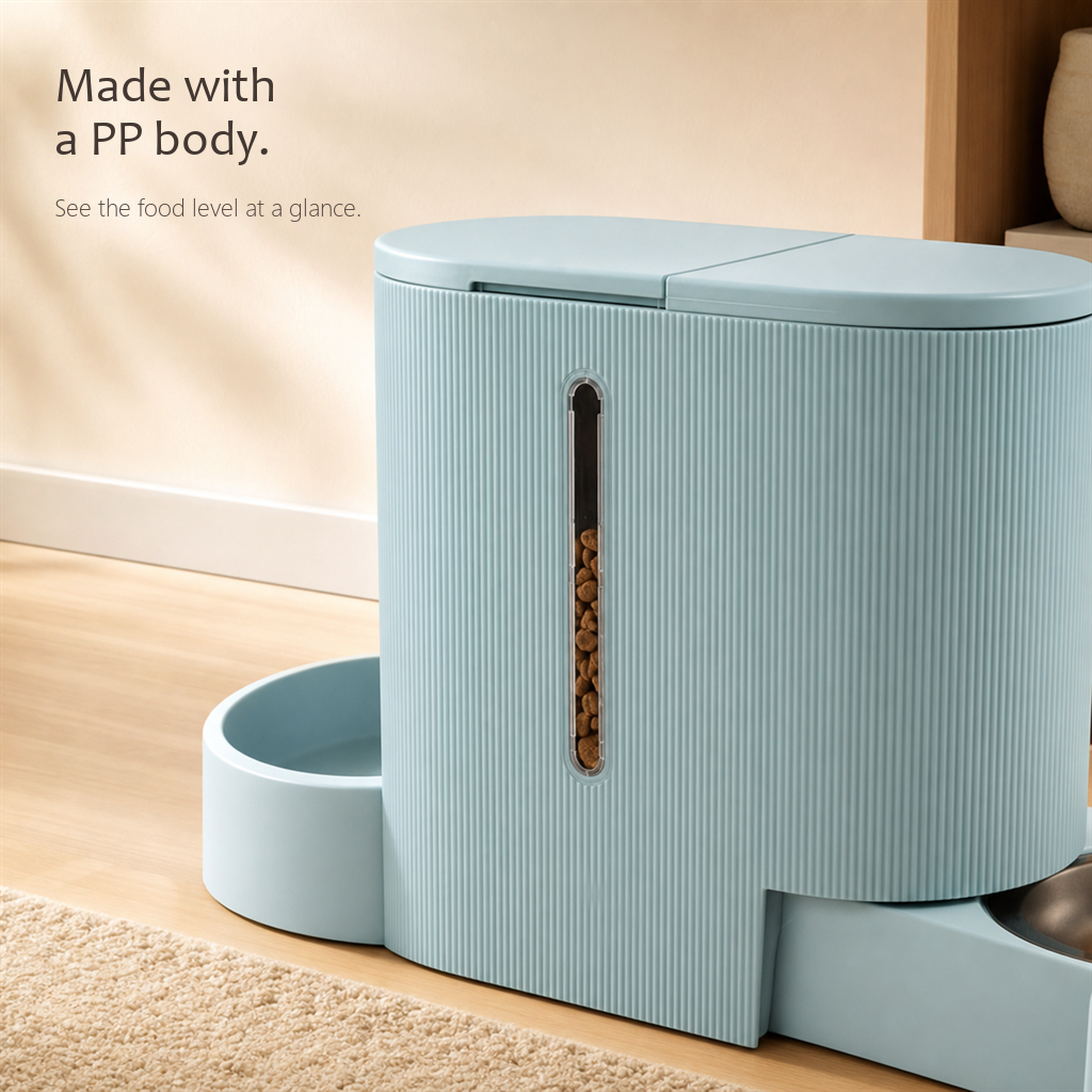 FeedFlow pet feeder in light blue, close-up of the ribbed food hopper with a clear window showing the kibble level inside.