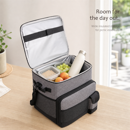 RollChill gray rolling cooler bag open, showing food containers, fruit, and a bottle inside.