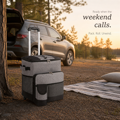RollChill gray rolling cooler on its trolley beside an SUV at a wooded campsite.