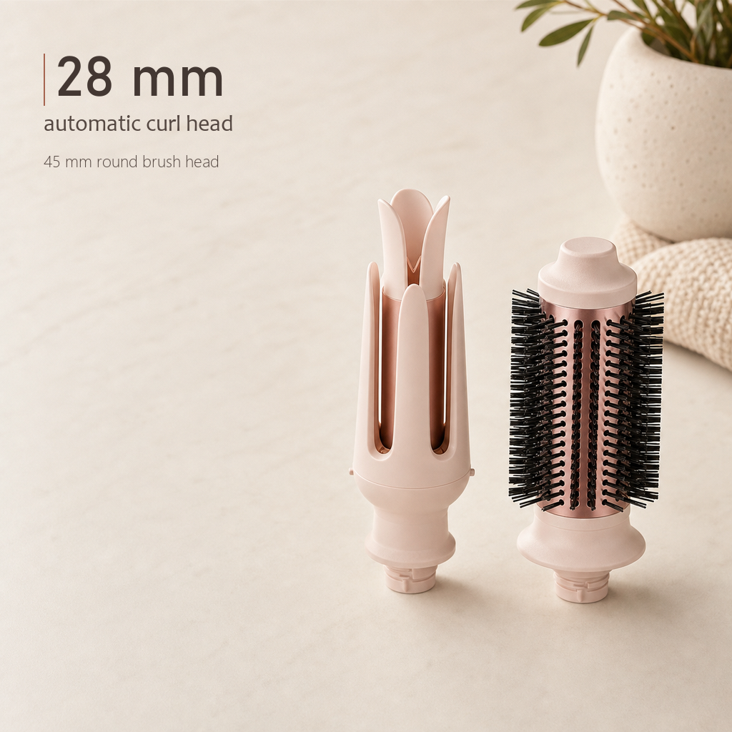 StyleOrbit hair styler's 28 mm automatic curl head and 45 mm round brush head shown side by side on a beige surface.
