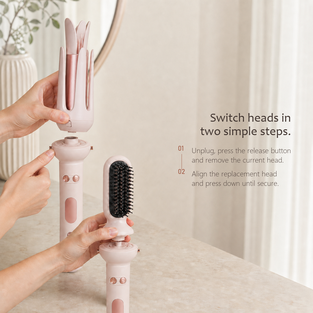 StyleOrbit hair styler in pink, hands lifting the curl head off one handle and fitting a brush head to a second.