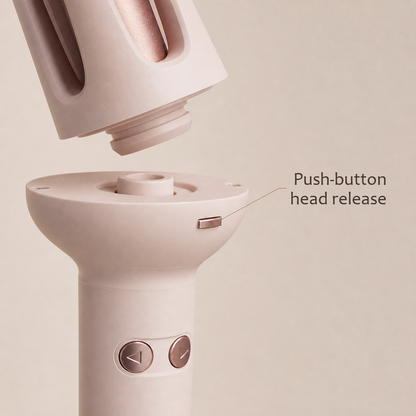 StyleOrbit hair styler in pink, close-up of the push-button head release between the handle and the curl head.