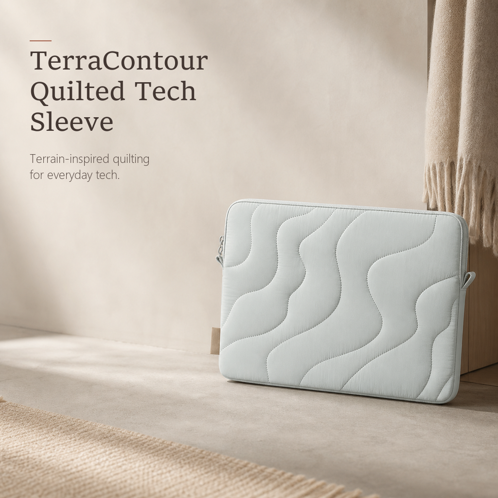 TerraSleeve laptop sleeve in cloud mist, front view with terrain-inspired wavy quilting on a soft warm beige studio backdrop.