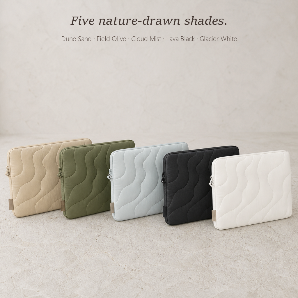 TerraSleeve laptop sleeve in five shades, dune sand, field olive, cloud mist, lava black and glacier white in a row on a pale stone backdrop.