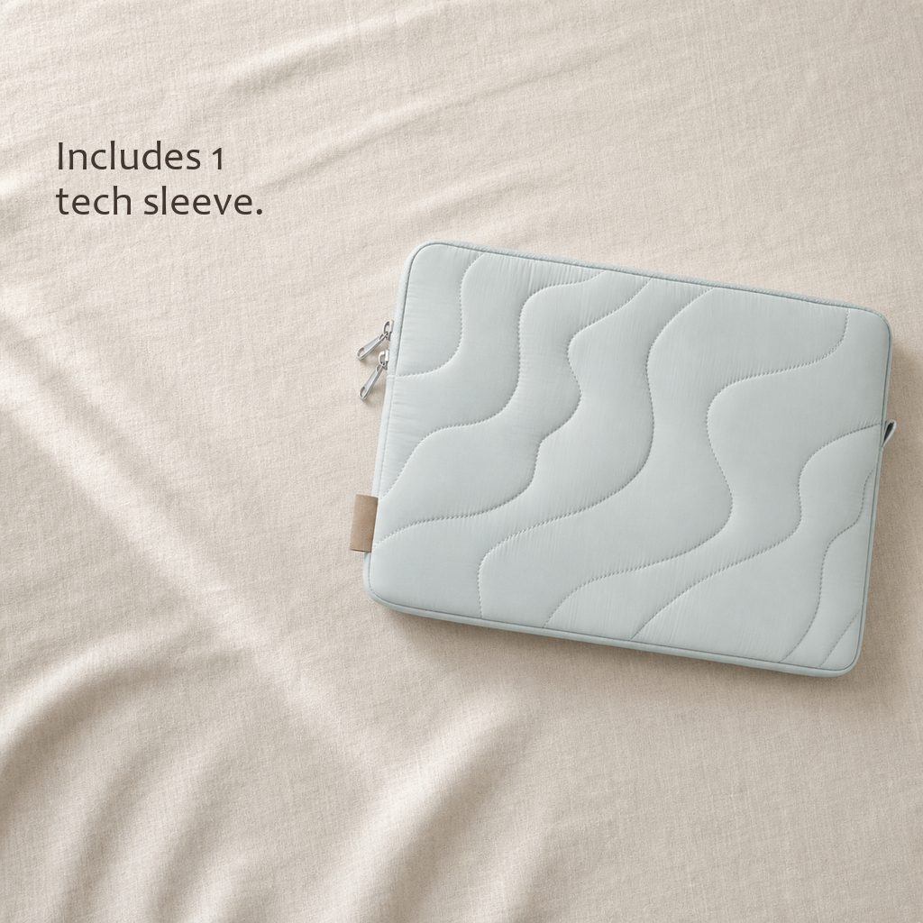TerraSleeve laptop sleeve in cloud mist, laid on soft cream linen with an Includes 1 tech sleeve label for what's in the box.