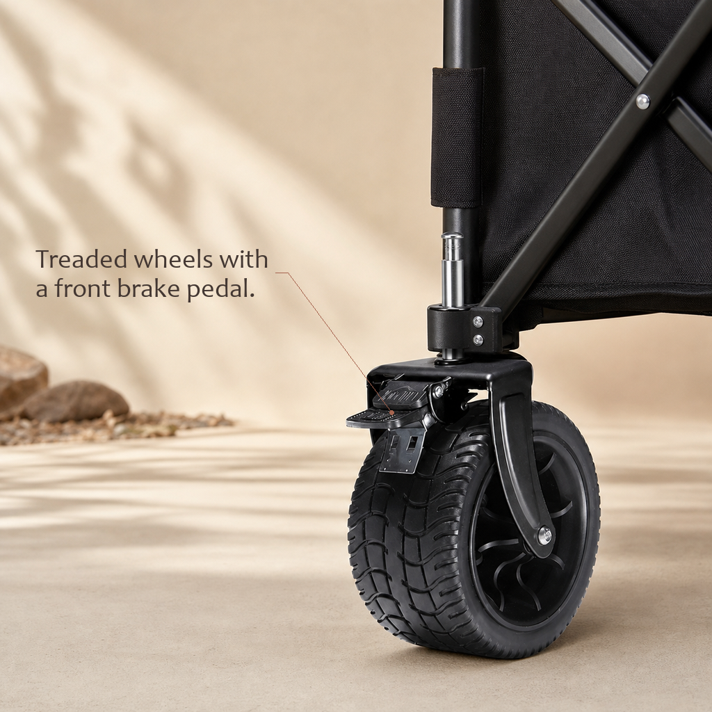 TrailFold utility wagon front wheel close-up showing the treaded tire and brake pedal.