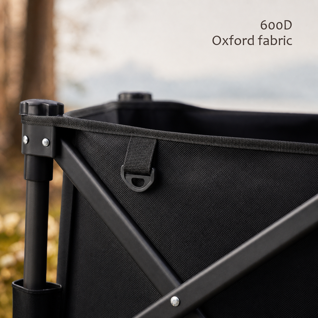 Close-up of a TrailFold wagon corner in black 600D Oxford fabric with steel frame hardware.