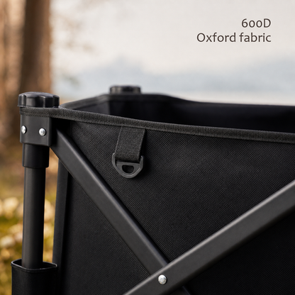 Close-up of a TrailFold wagon corner in black 600D Oxford fabric with steel frame hardware.