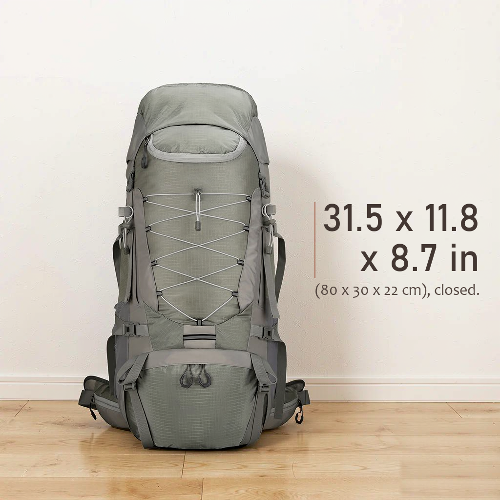Straight-on front view of the closed TrailFrame 75L backpack standing on a pale oak floor against a warm white wall.