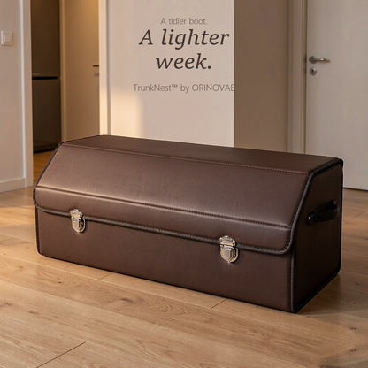TrunkNest™ Foldable Car Trunk Organizer Box — closed coffee brown trunk in a bright hallway with brand name on wall